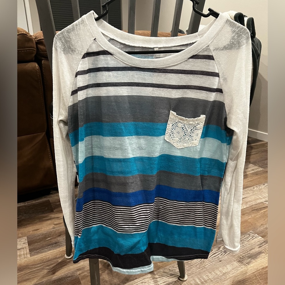Women’s size large dress shirt.